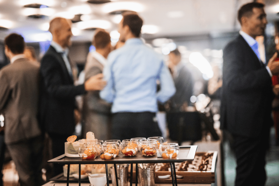 food served and people talking at a client appreciation event