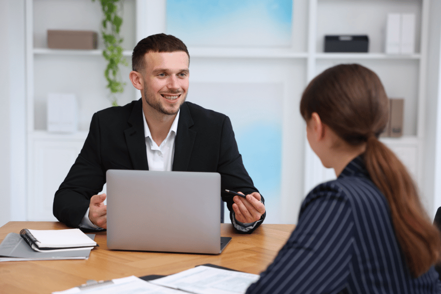 real estate agent meeting with a buyer and discussing home options.