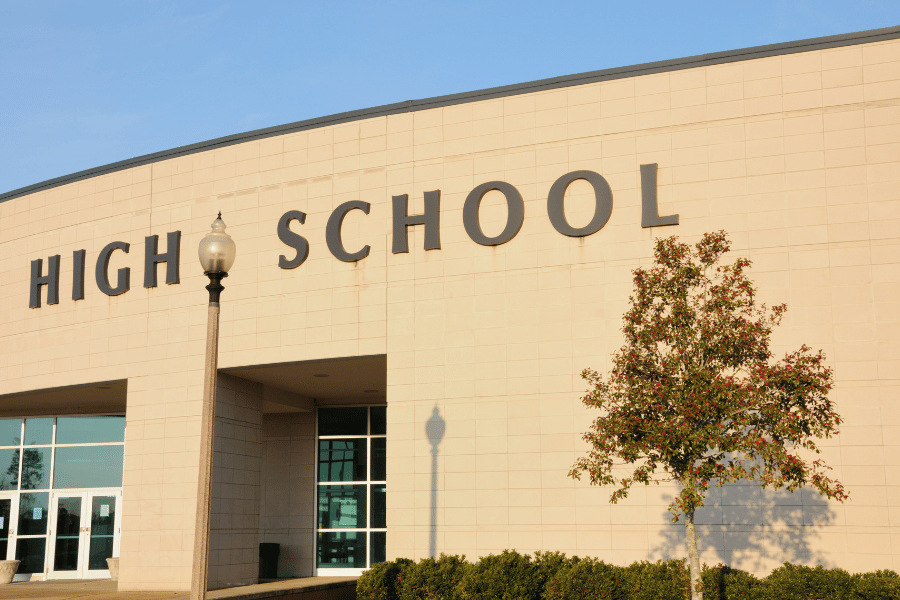 Front of high school building. Homes command higher prices in reputable school districts.