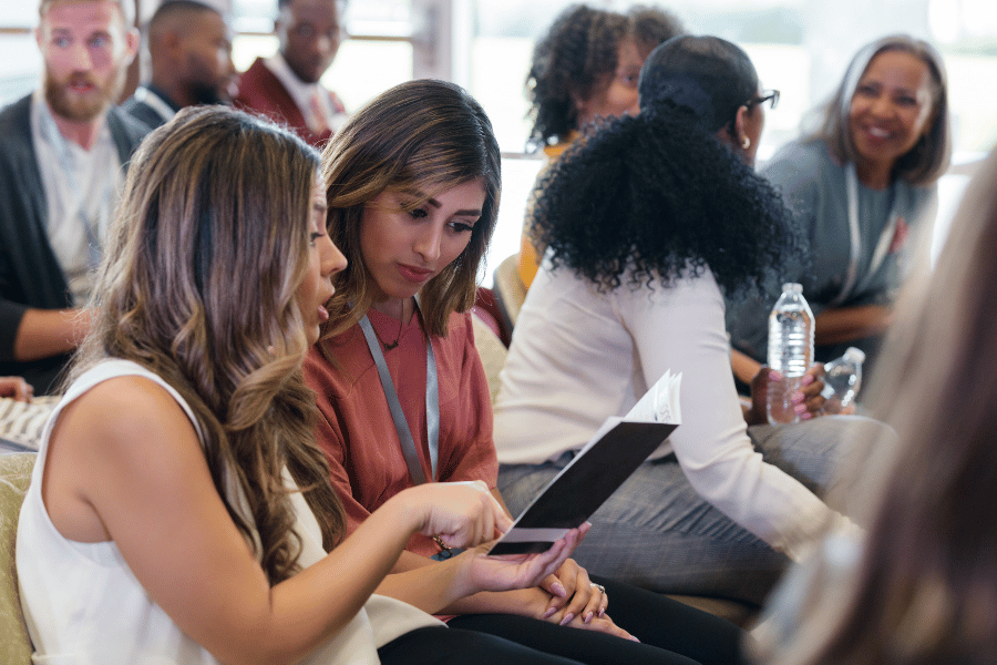 real estate agents meeting and talking at an industry event