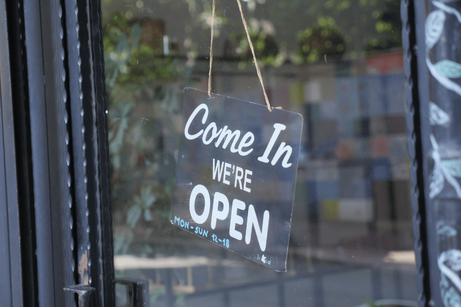 local business with a open sign on the front door