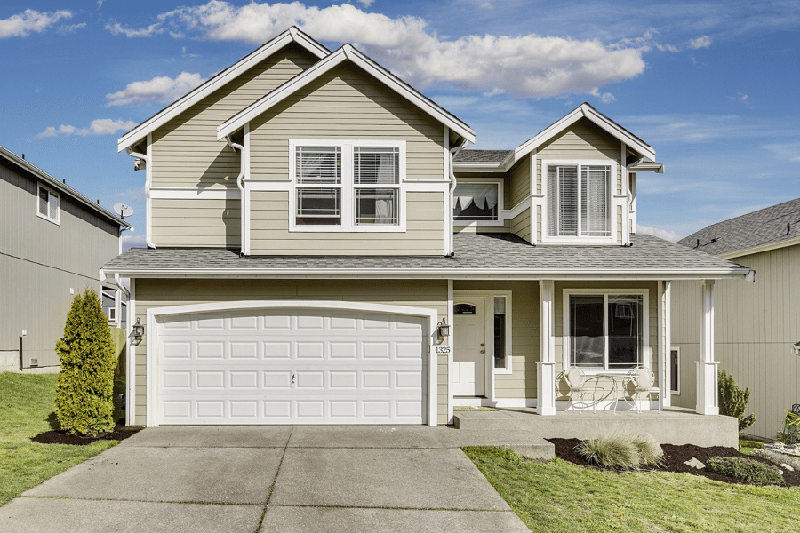 single-family home off-market listing with front porch and two-car garage.