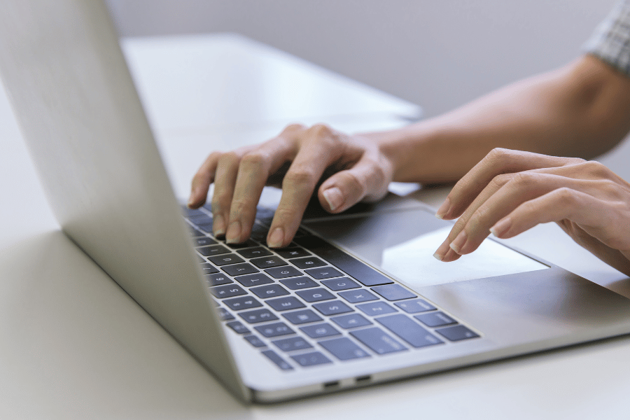 real estate professional working on laptop computer
