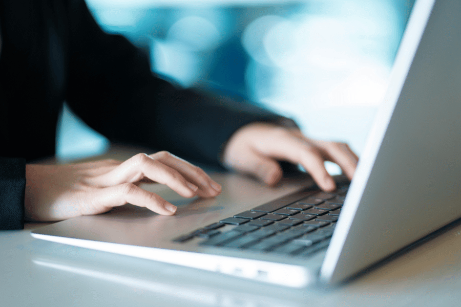 real estate agent working on a laptop and segmenting data