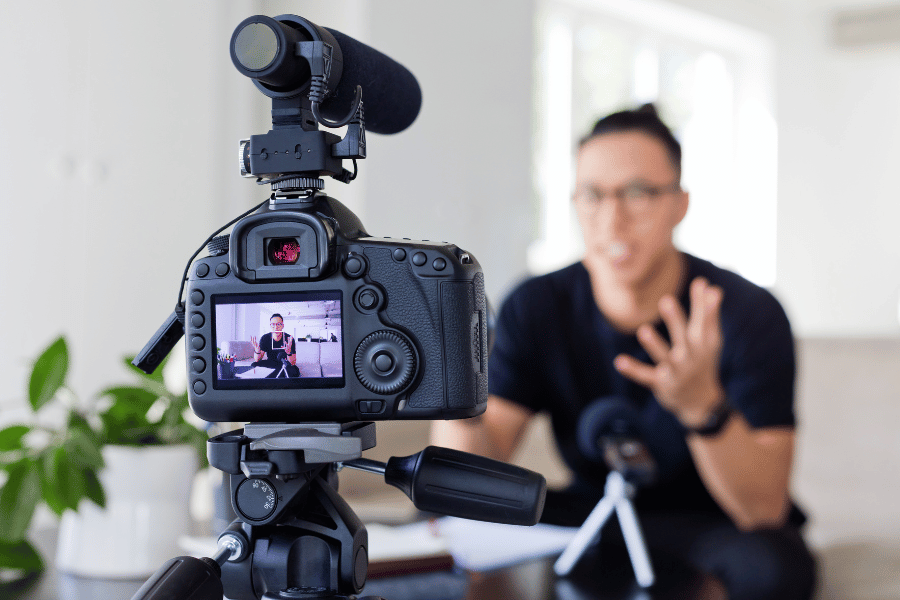 real estate agent creating personalized video message with camera