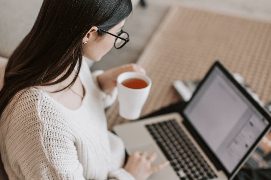 real estate professional creating social media content on laptop
